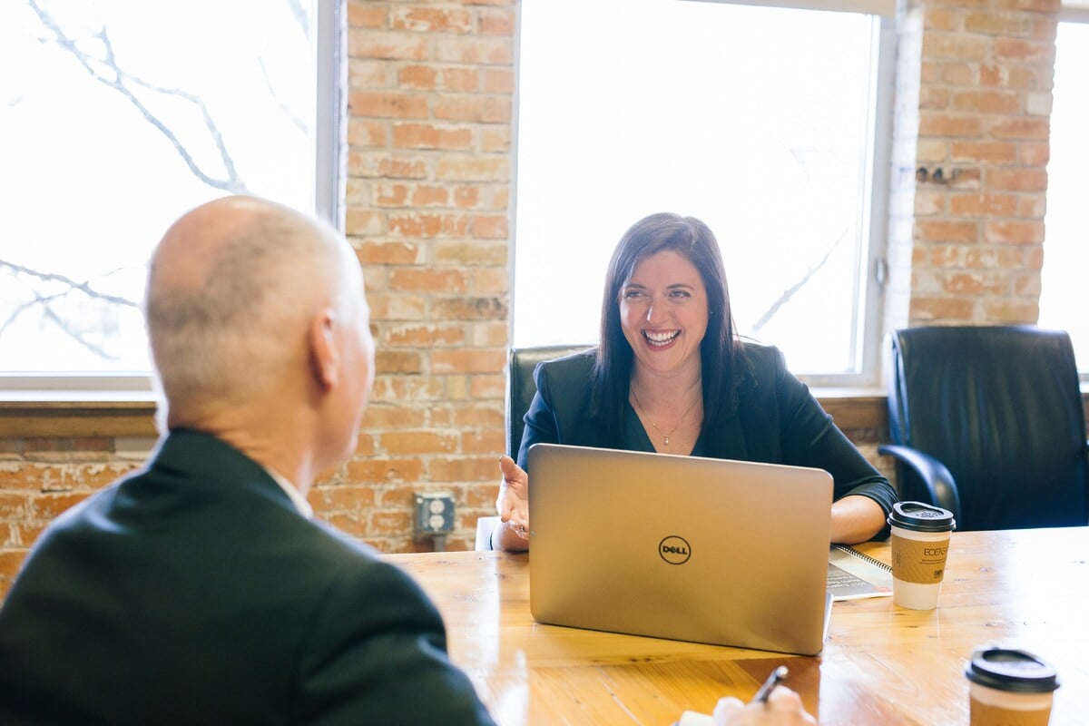 Two people discussing at desk